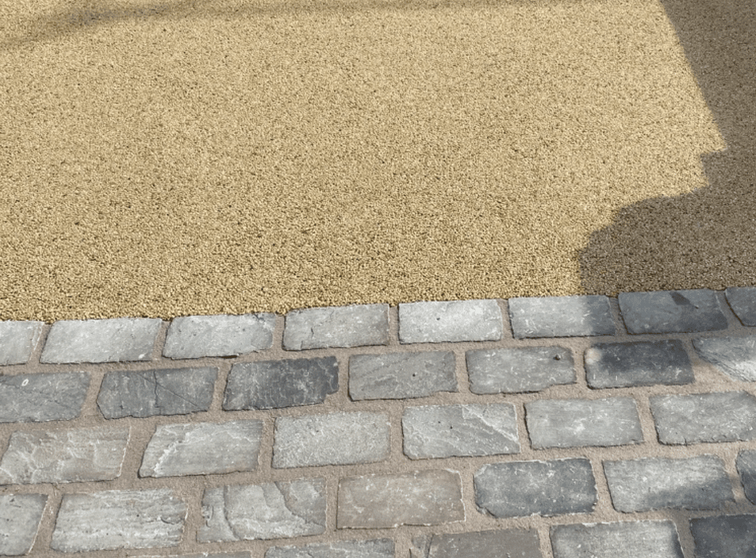 Grey sandstone setts with resin bound