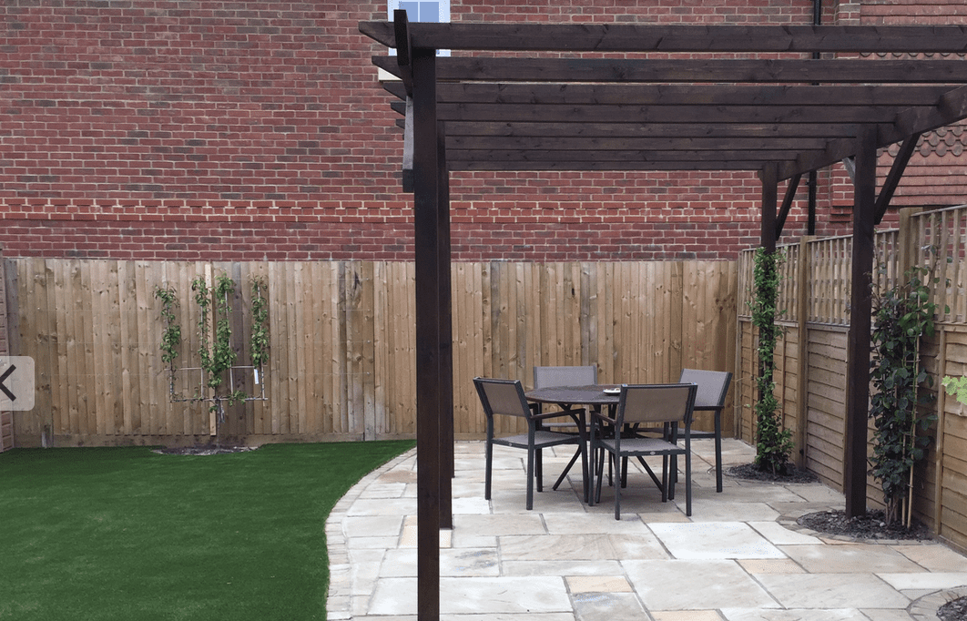 Landscaper in Crawley Mint sandstone patio and pergola