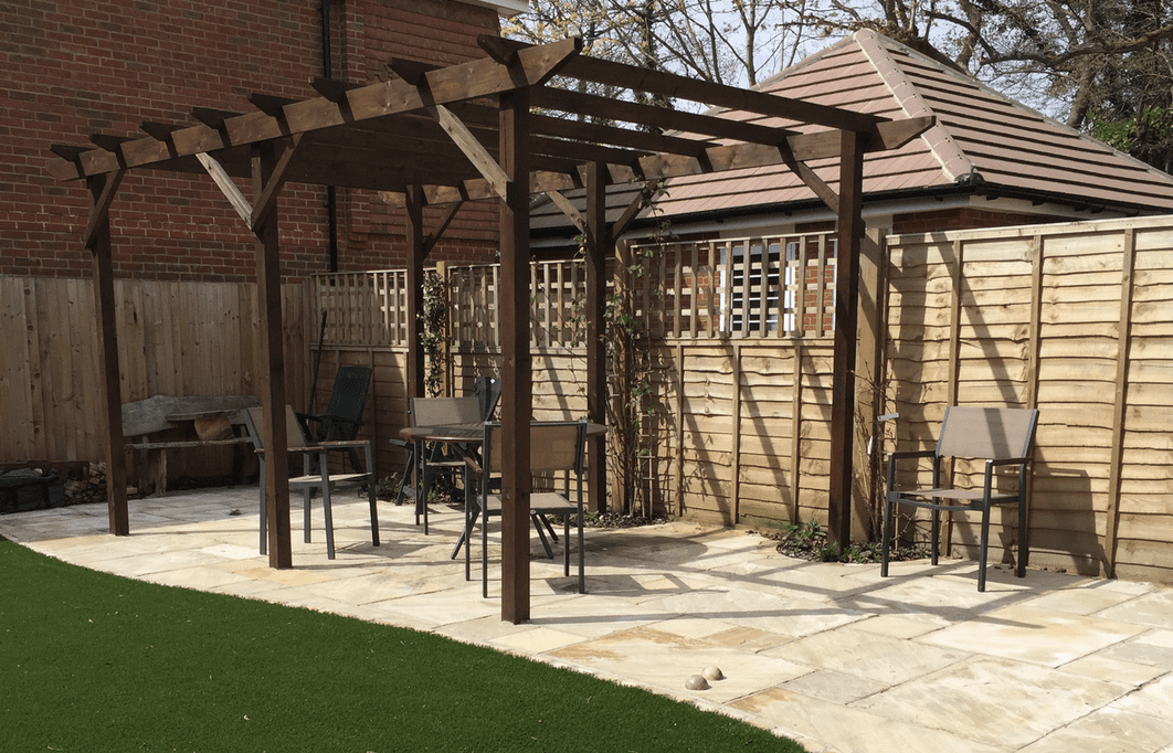 Wooden pergola and patio Sandstone patio Reigate