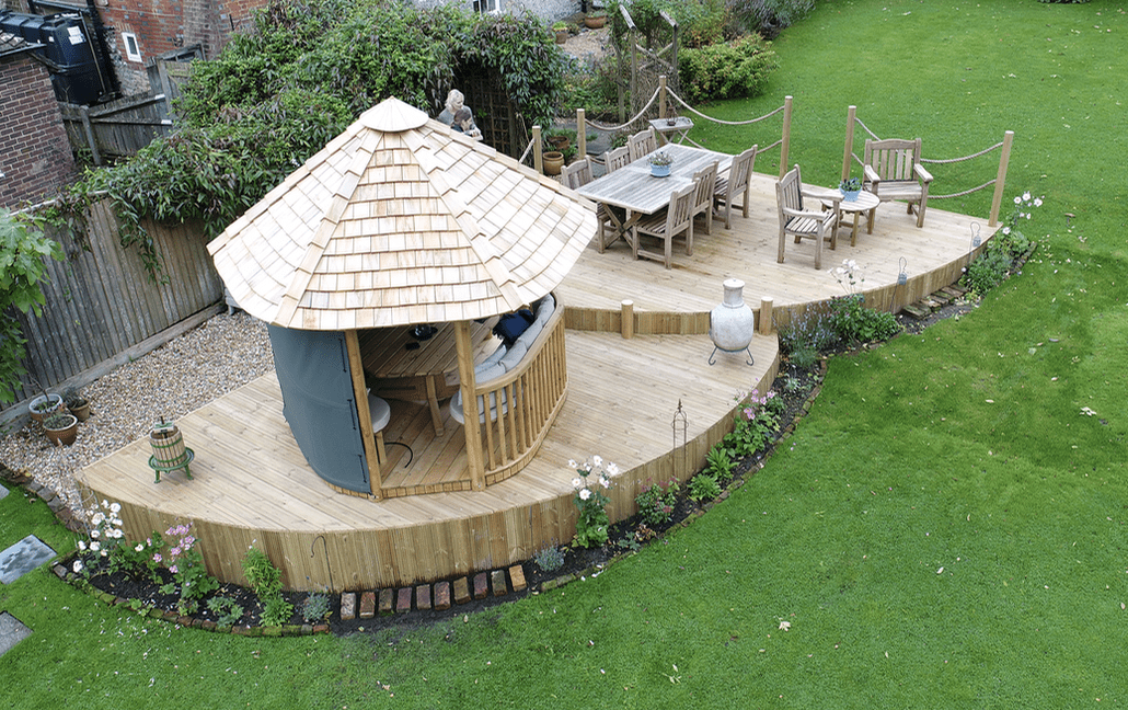 Wooden structure on softwood decking Surrey softwood deck dining area