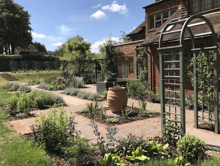Surrey traditional water feature and planting Traditional water feature